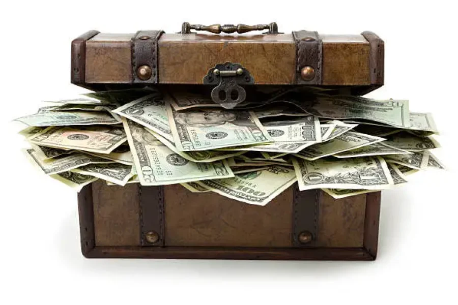 Treasure chest overflowing with money.